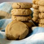 A stack of maple brown sugar cookies with a maple glaze.