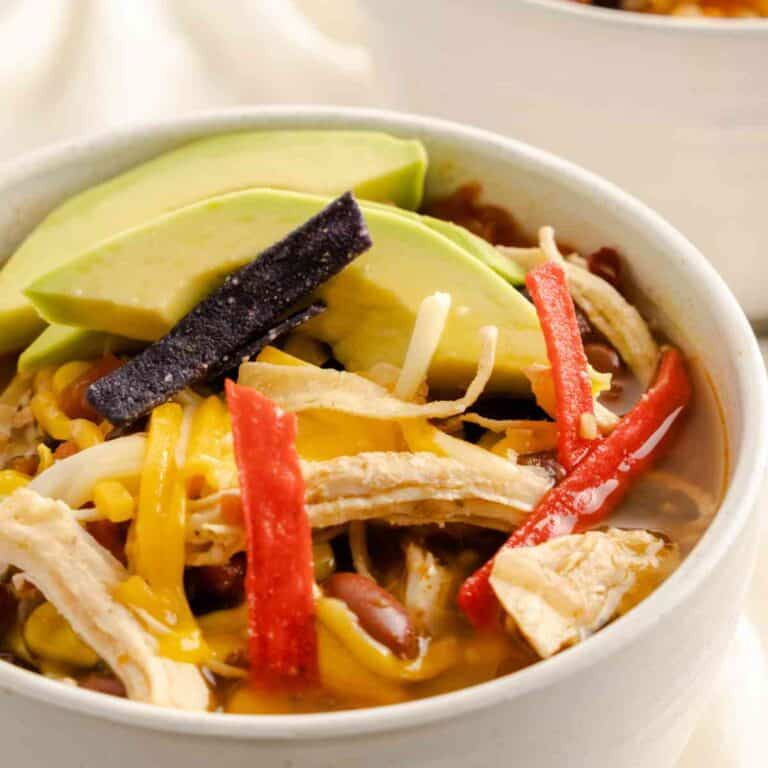 Instant Pot Chicken Tortilla Soup with avocado slices.