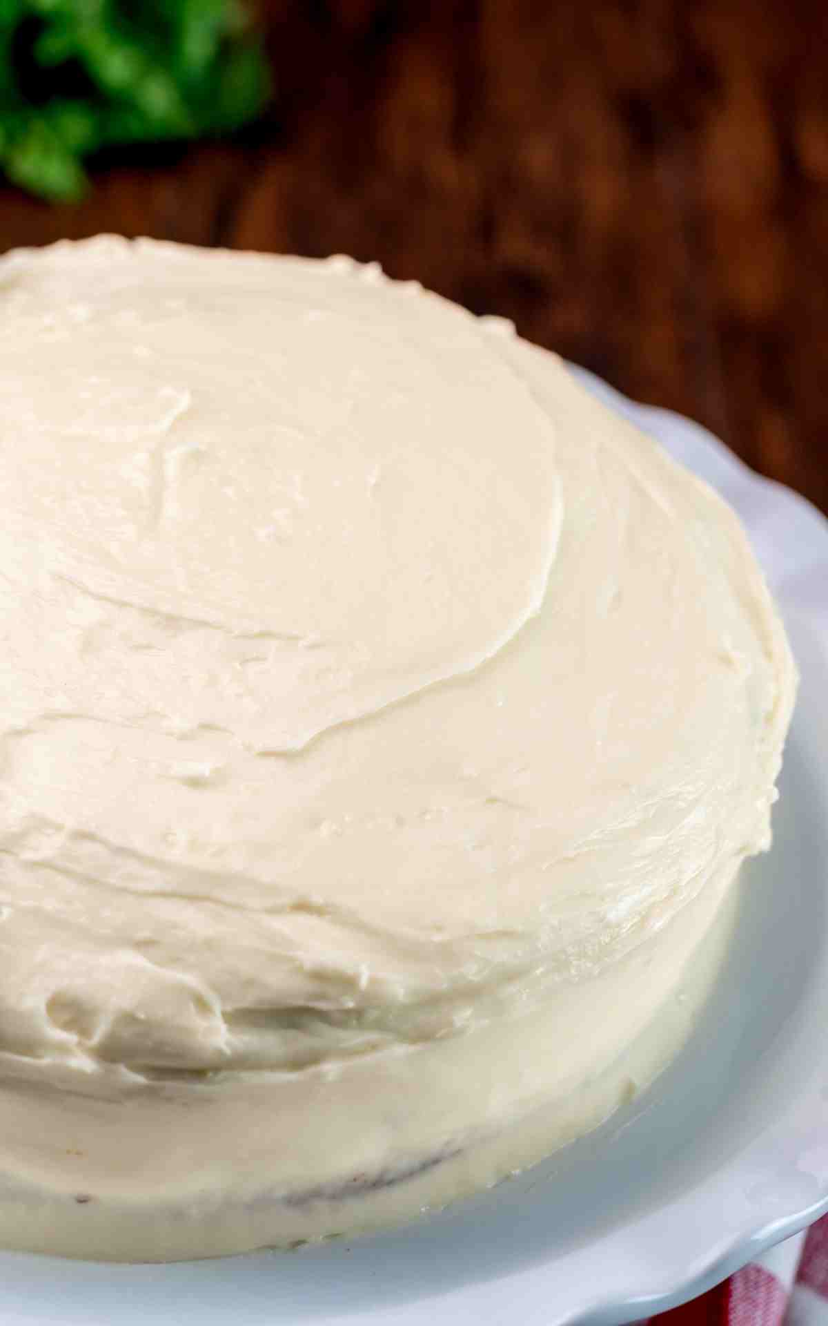 A layered carrot cake with cream cheese frosting.