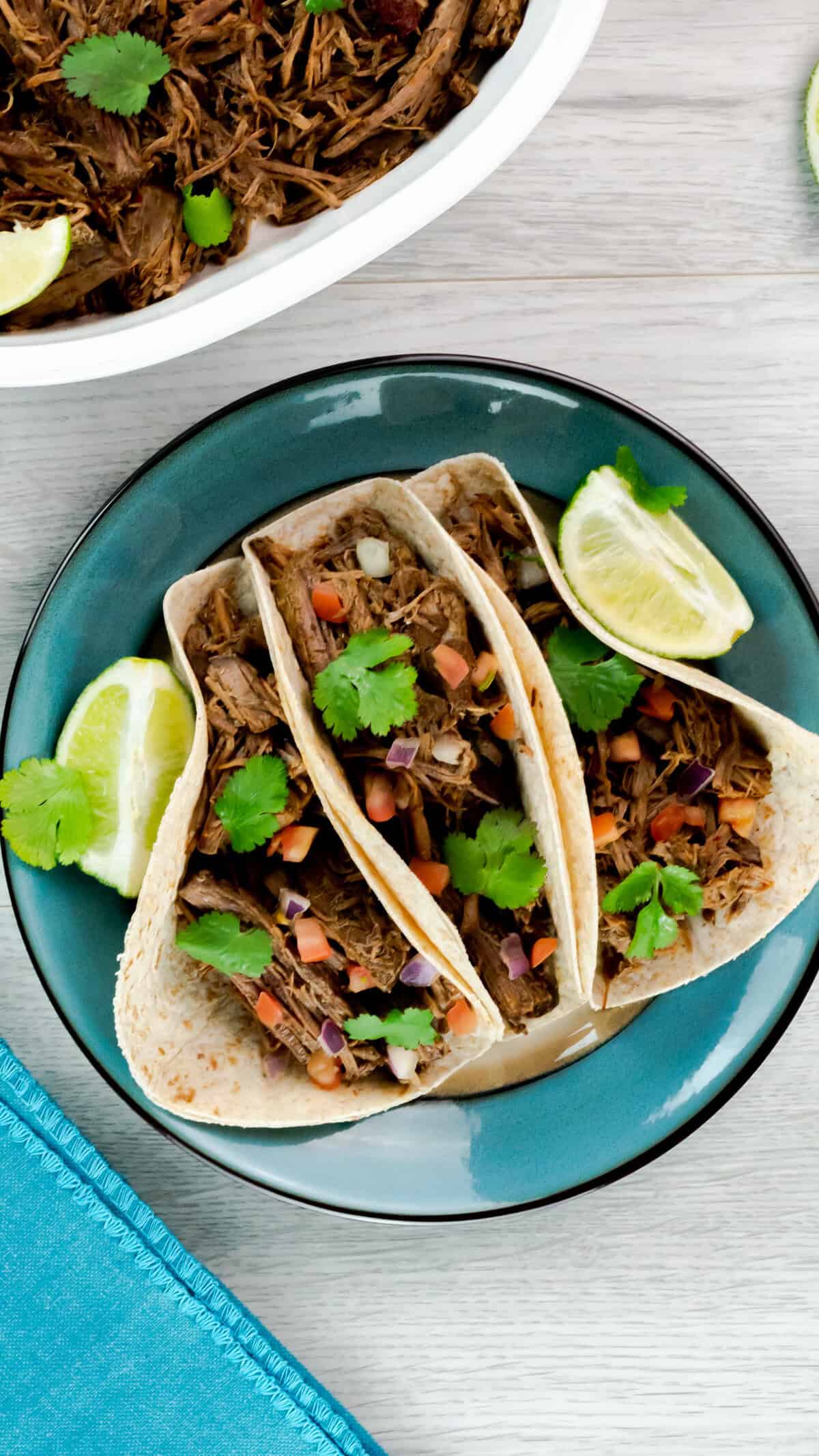 Birdeye view of Instant Pot Barbacoa Beef in tacos.