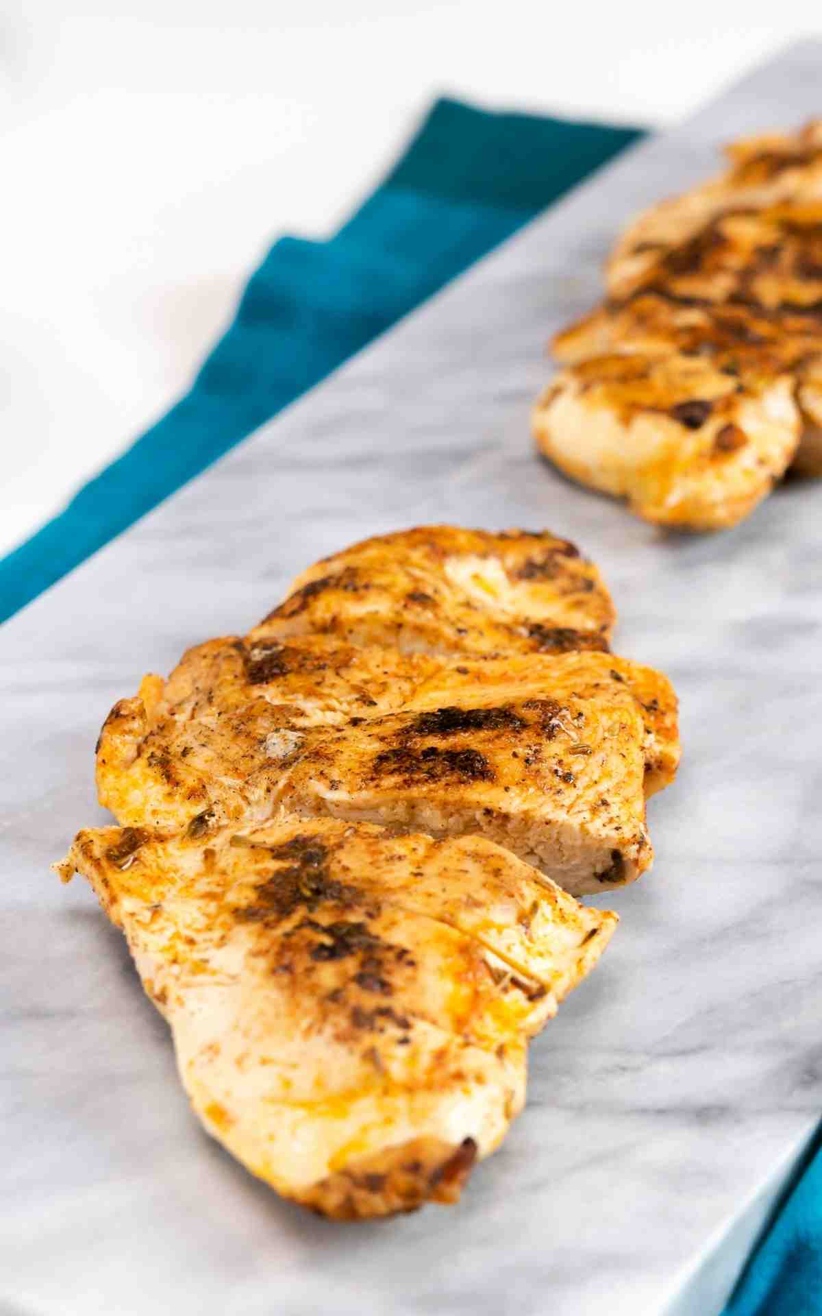 Resting sliced skillet blackened chicken.