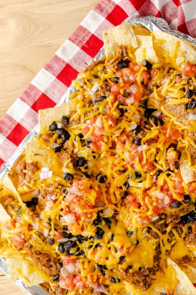 Tortilla chips tolled with pulled pork, salsa, cheese, and red onions.
