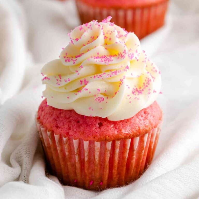 Close up of Pink Velvet Cupcakes on white linen.