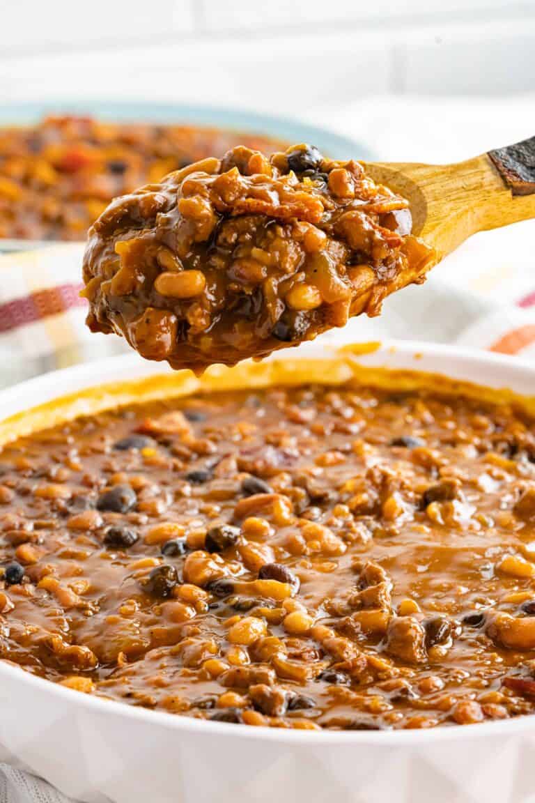 Cowboy Beans that were made in the Instant Pot and scooped on a spoon.