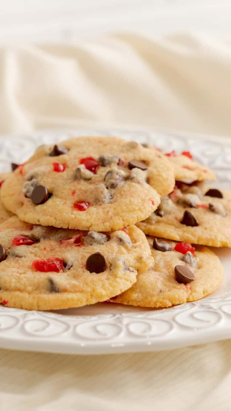 stacked cherry chocolate cookies on white decorative plate