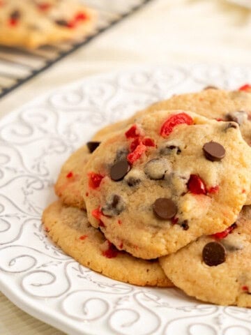 cherry chocolate chip cookies on a white decorative plate
