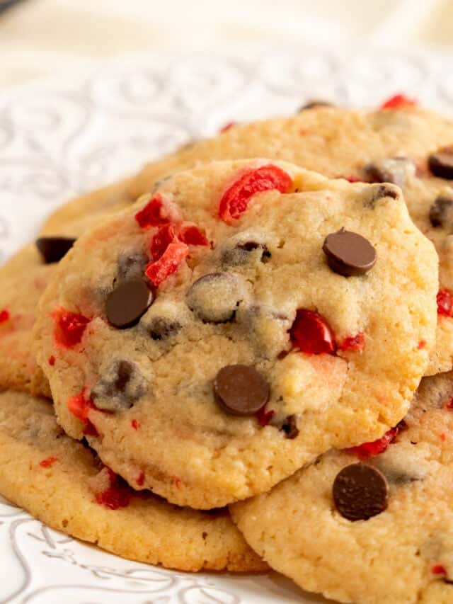 cherry chocolate chip cookies on a white decorative plate