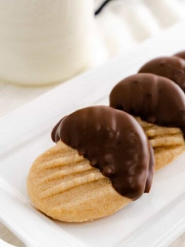 heart peanut butter cookies and a glass of milk