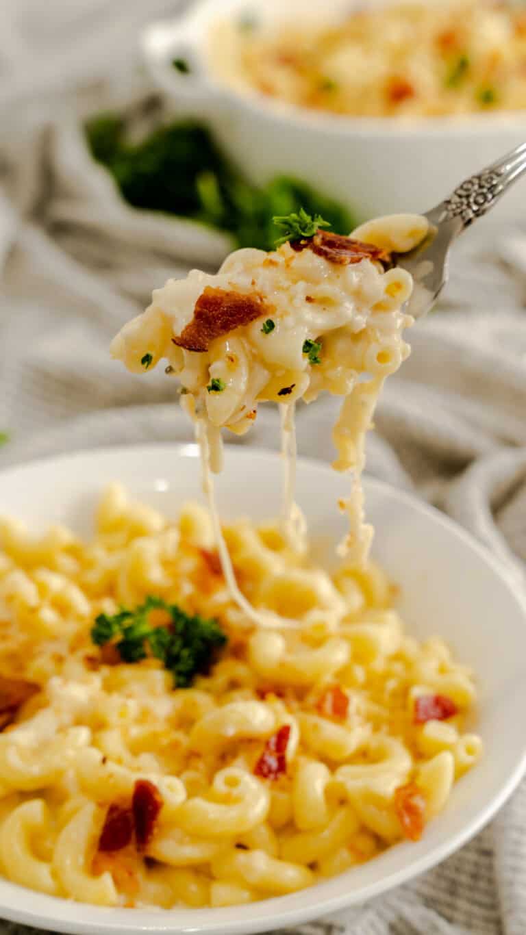 mac and cheese on fork with bacon and parsley