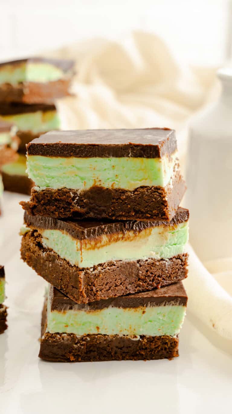 chocolate fudge brownies with mint green cheesecake filling and chocolate ganache frosting