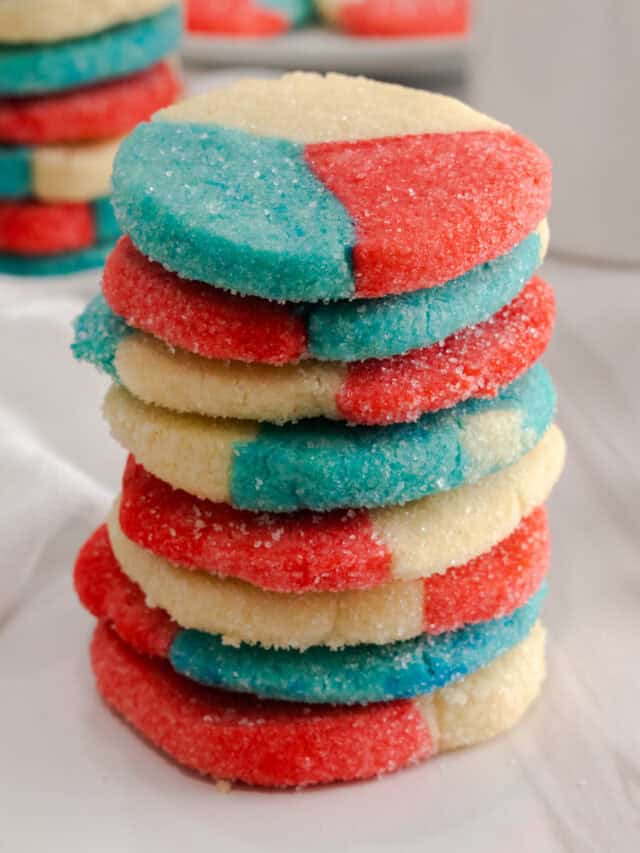 Close up of stack of red white and blue sugar cookies.