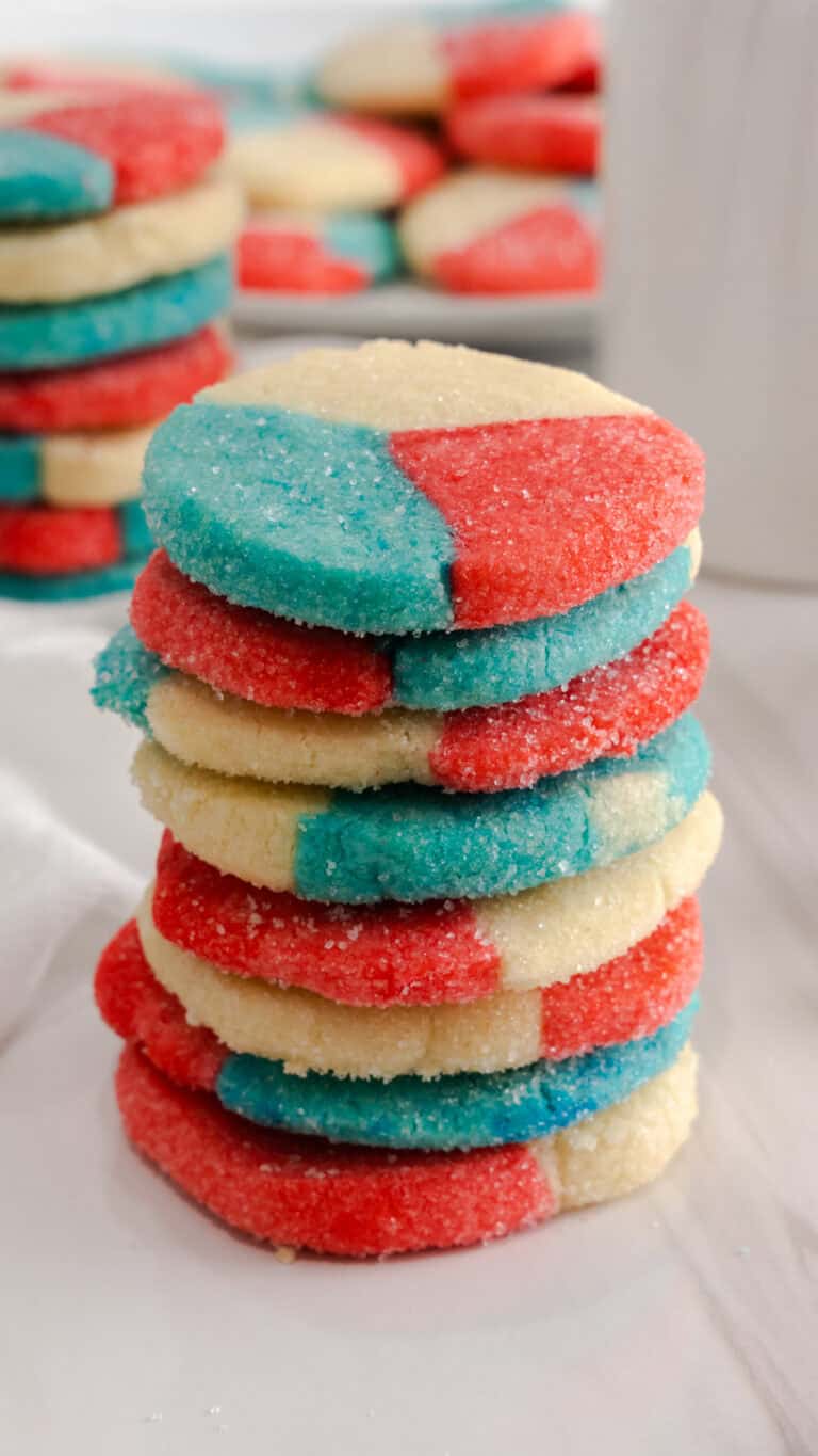 Close up of stack of red white and blue sugar cookies.
