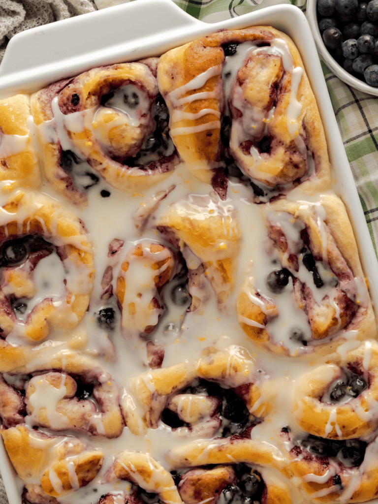 sweet rolls with blueberries and glazed with lemon