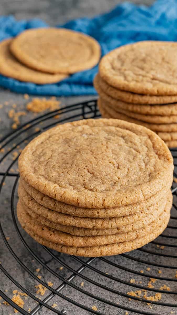 A small stack of brown sugar cookies on wire rack.
