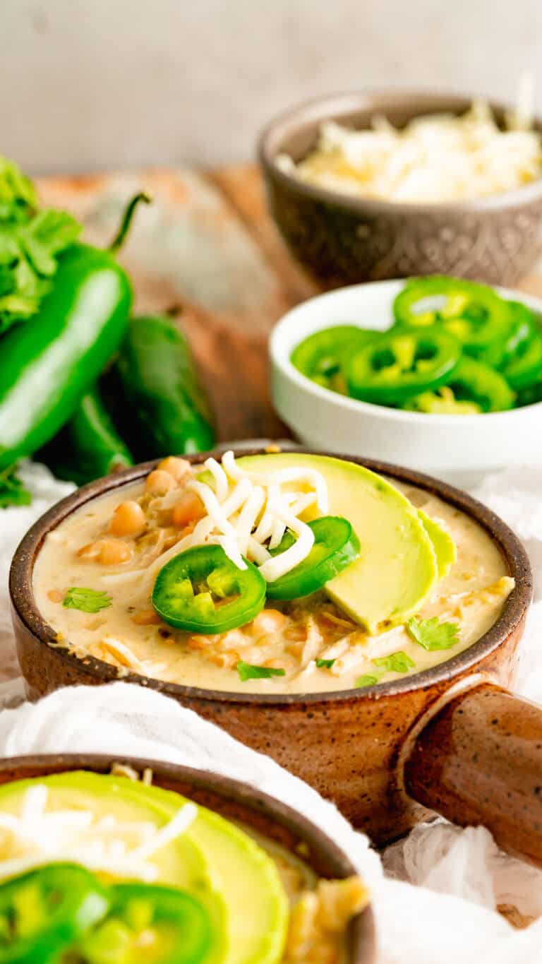 Instant Pot Salsa Verde Chicken Chili in a brown bowl with handle.