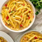 Three bowls of Instant Pot Rotel Pasta garnished with cilantro.