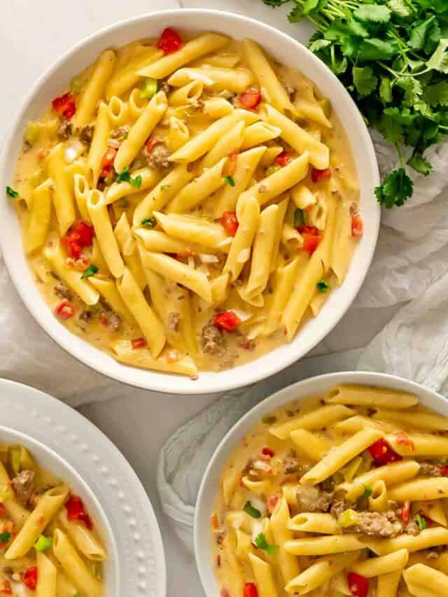 Three bowls of Instant Pot Rotel Pasta garnished with cilantro.