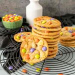 A stack of drop Halloween Sugar Cookies with Halloween M&M's.