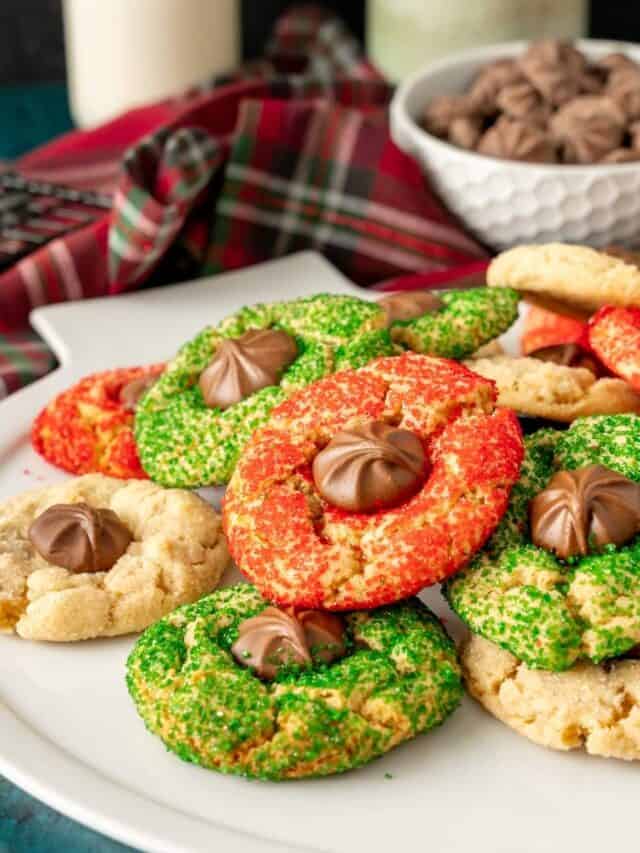 Christmas kiss cookies decorated with red and green sanding sugar.
