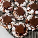Peppermint Hot Cocoa Crinkle Cookies with a snowflake York peppermint patty pressed in the center.