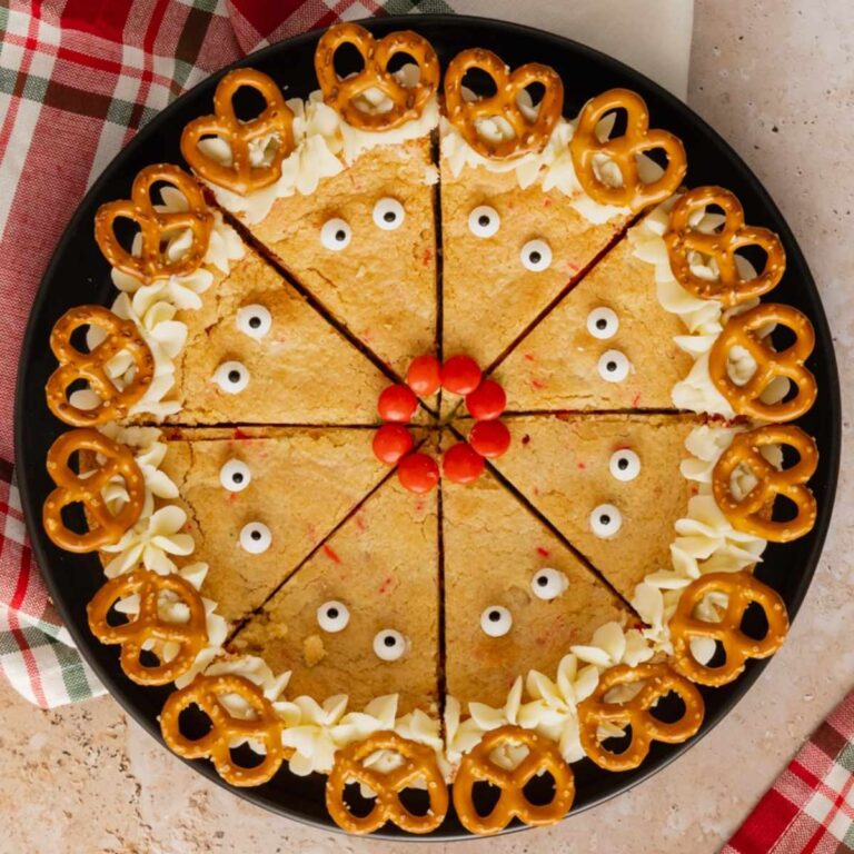 Reindeer Sugar Cookie Bars cut into triangles and decorated like reindeer.