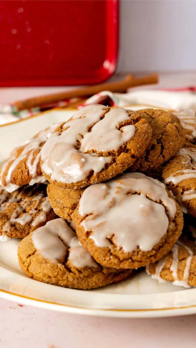 A plate of spice cookies with rum glaze that are dipped and drizzled.