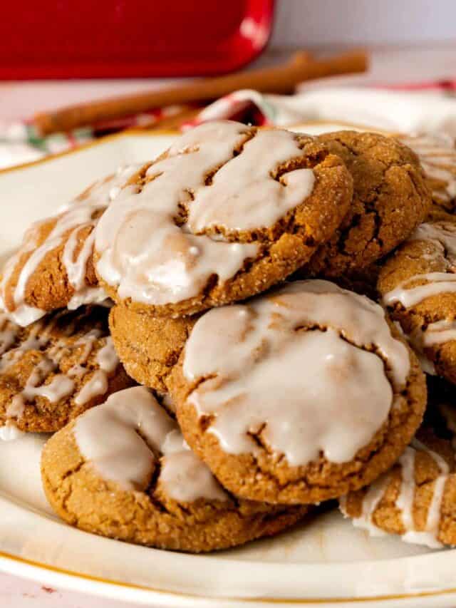 A plate of spice cookies with rum glaze that are dipped and drizzled.