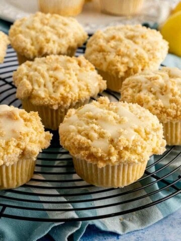 Bakery style lemon muffins with streusel topping with lemon glaze.