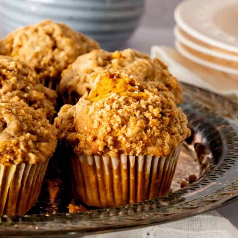 Pumpkin banana muffins on a vintage serving tray.