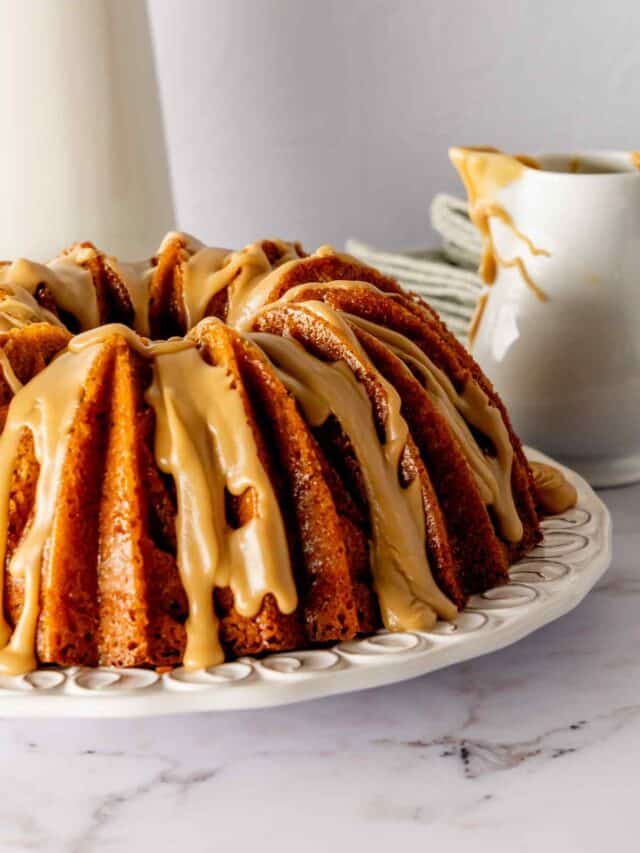 A whole brown sugar bundt cake glazed with caramel icing.