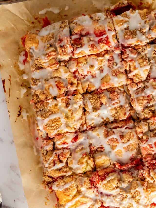 Cut squares of Cherry Coffee Cake on parchment paper.