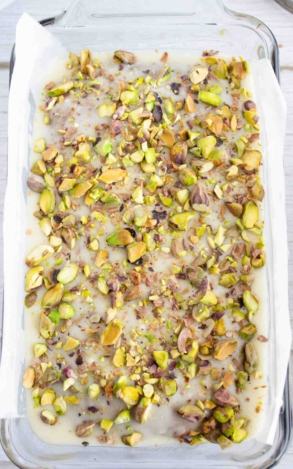 Crushed pistachios on almond icing for pistachio bread.