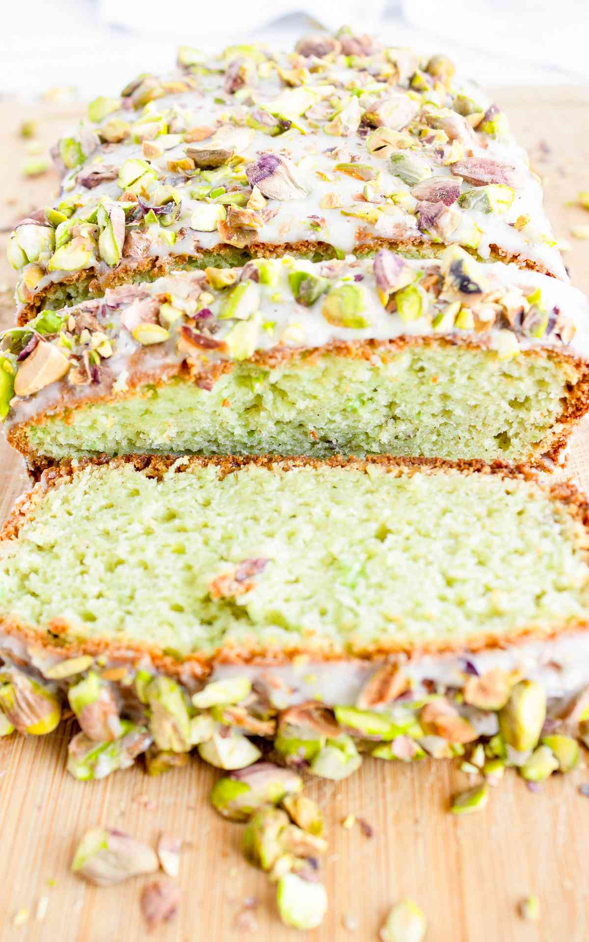 Sliced pistachio bread glazed with sweet almond icing and crushed pistachios.