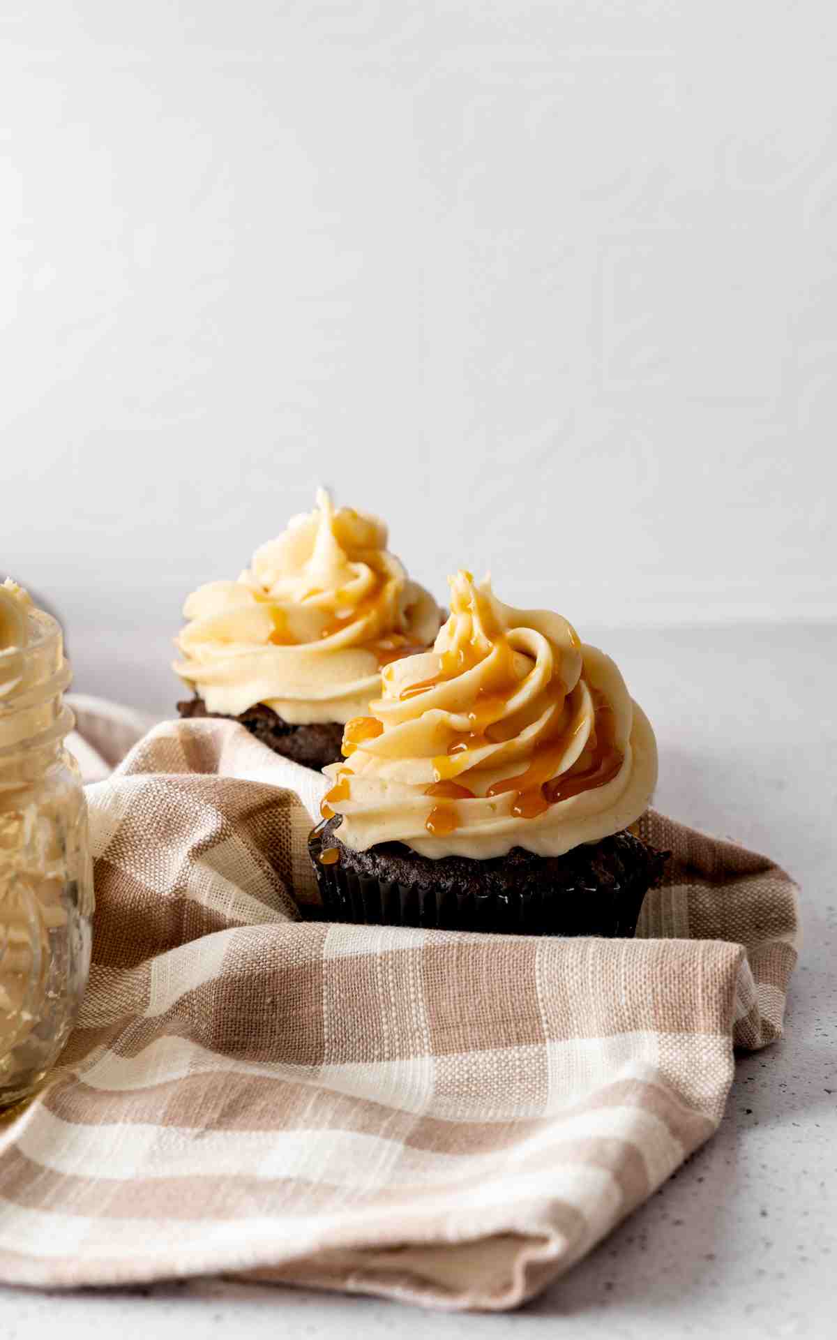 A chocolate cupcake topped with salted caramel buttercream.