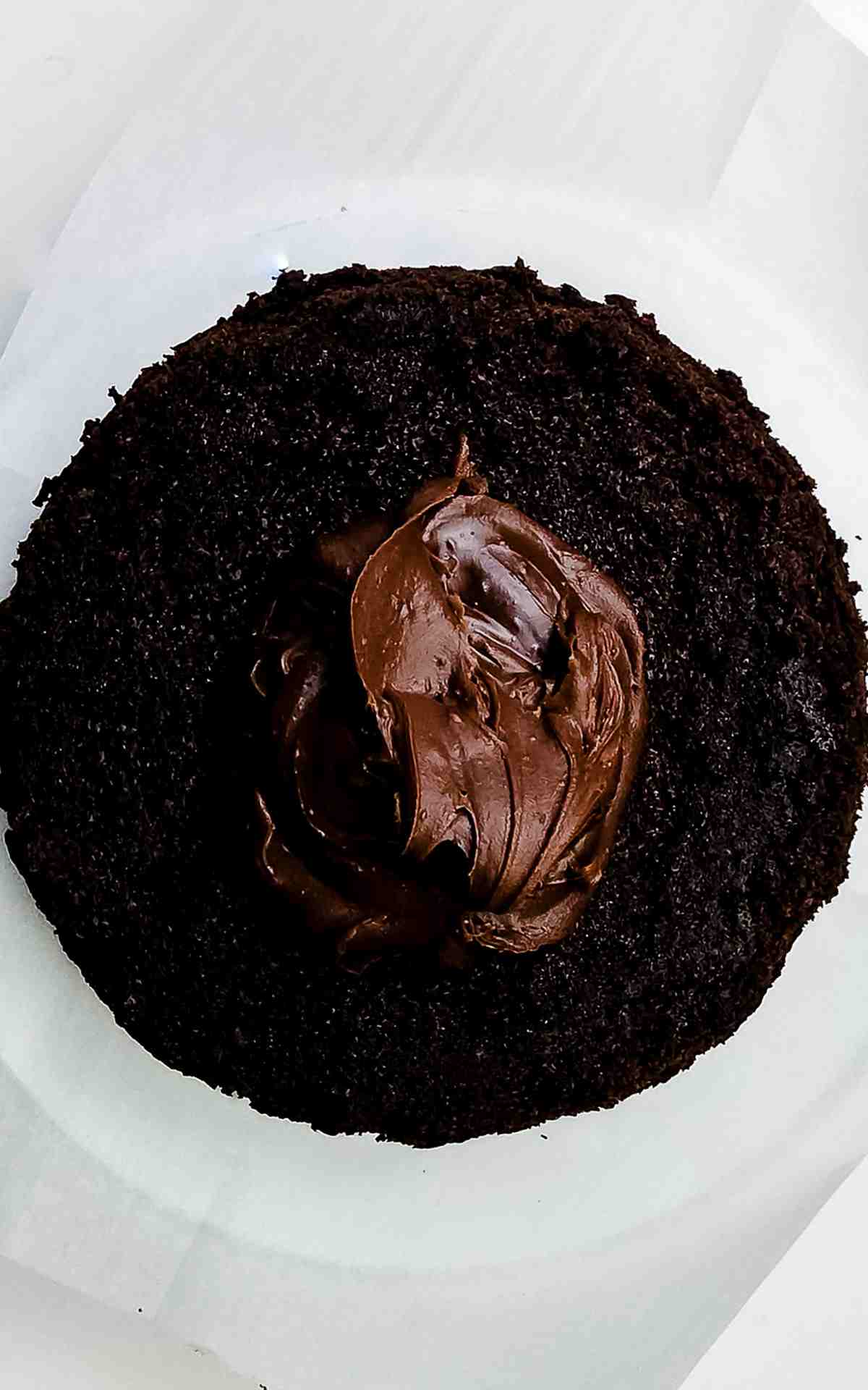 Chocolate soak on chocolate layer with frosting.