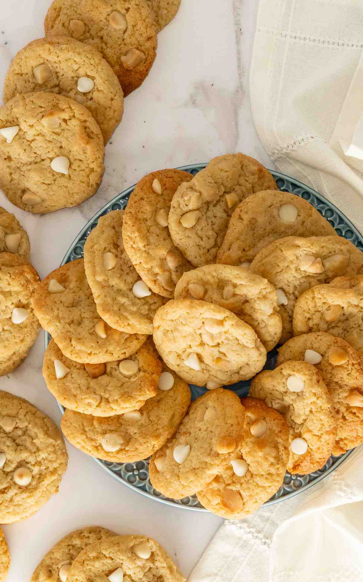 A platter with lemon macadamia cookies spread into a circle.