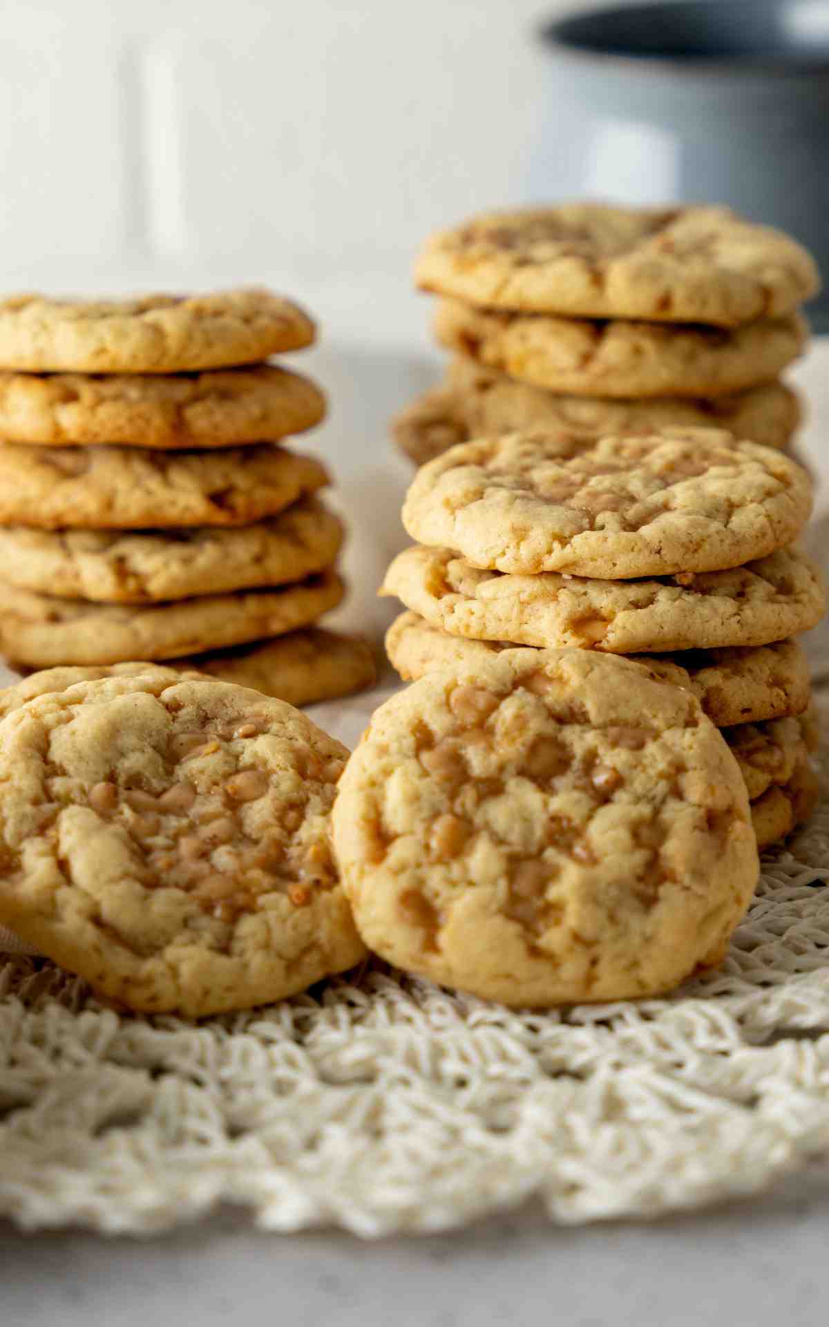 A stack of cookies with toffee pieces melted on top of them.