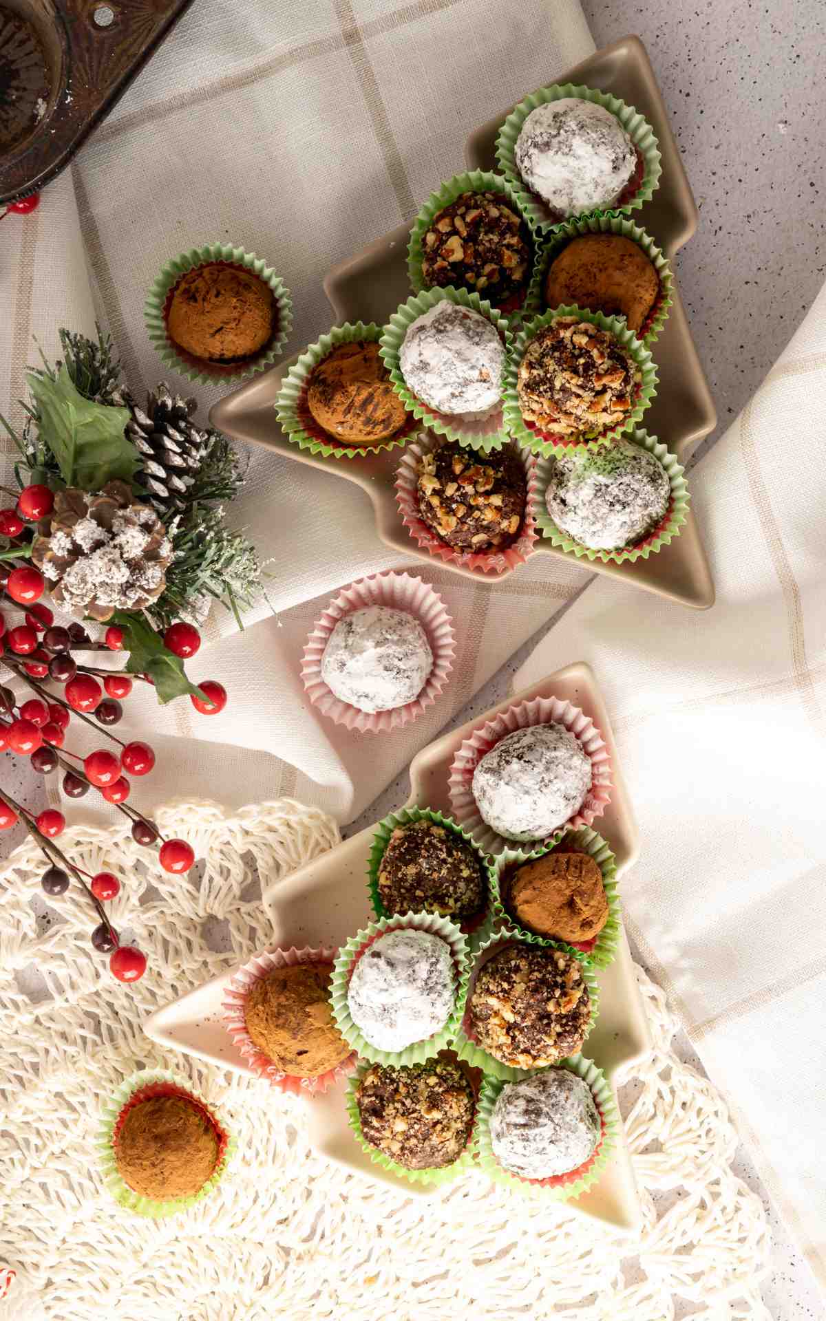 Christmas shaped plates with rum balls in mini cupcake liners.
