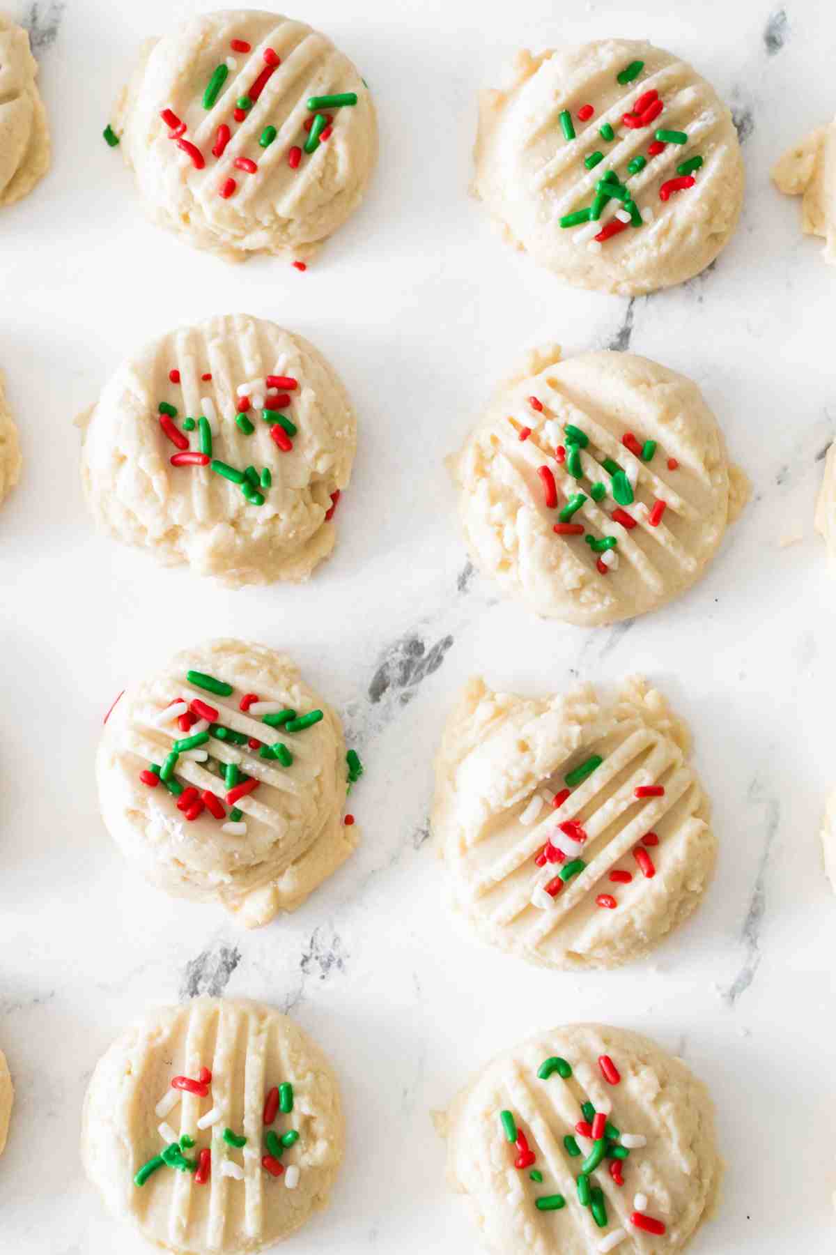 Whipped shortbread cookies with festive sprinkles.