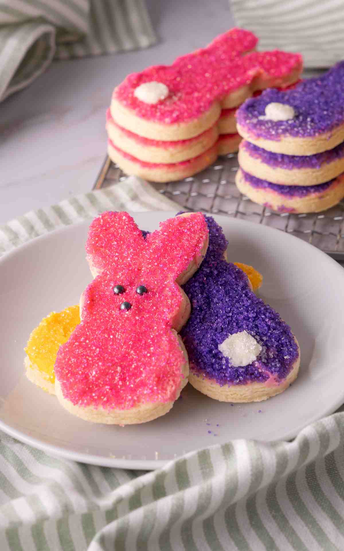 Buttercream sugar cookies that are decorated with colored sugar.