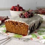 Gingerbread loaf cake iced with vanilla glaze featured image.