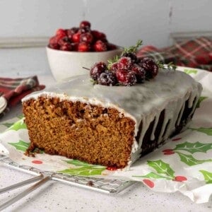 Gingerbread loaf cake iced with vanilla glaze featured image.