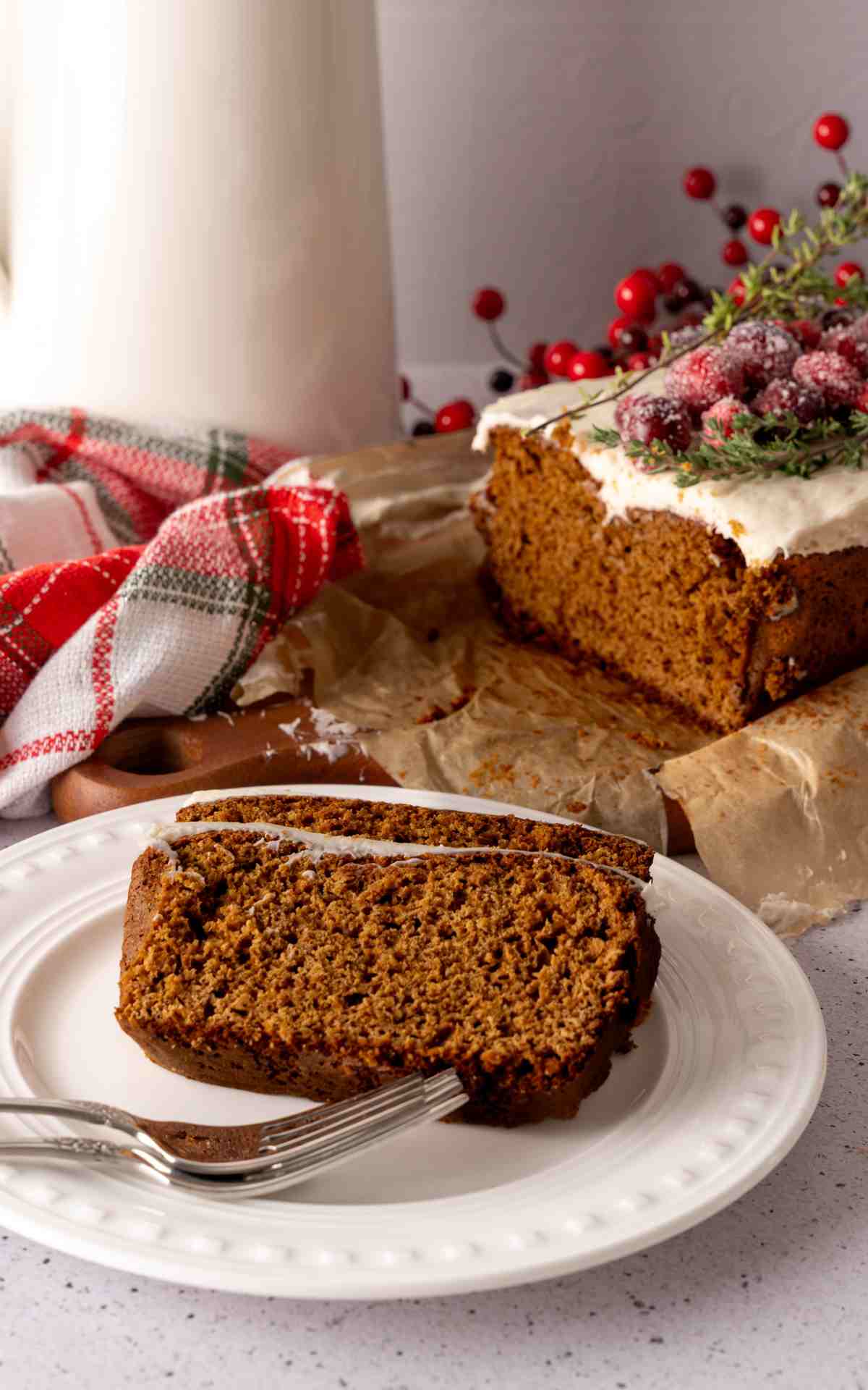 Two slices of cake mix gingerbread loaf on a plate with forks.