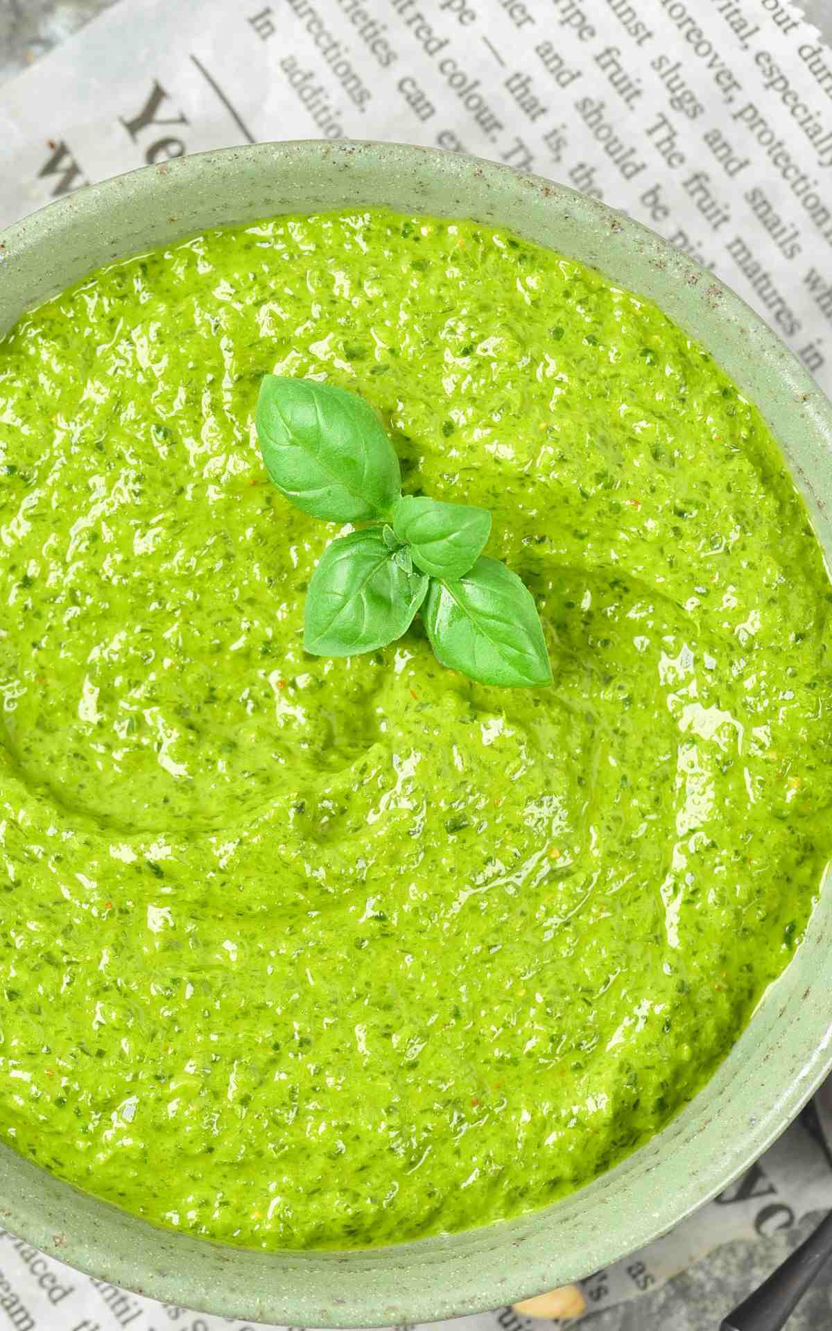 Freshly made basil pesto in a bowl.