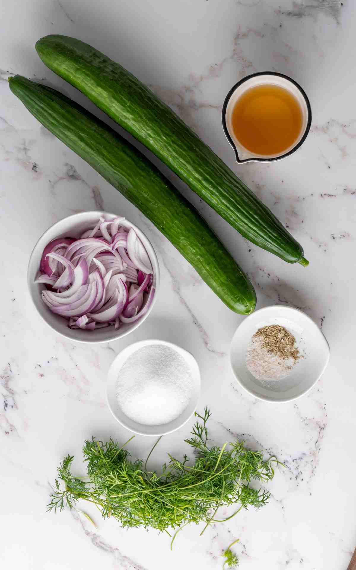 Ingredients to make a cucumber salad recipe.