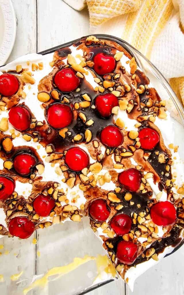 Banana Split Cake Mix recipe topped with cherries and nuts.