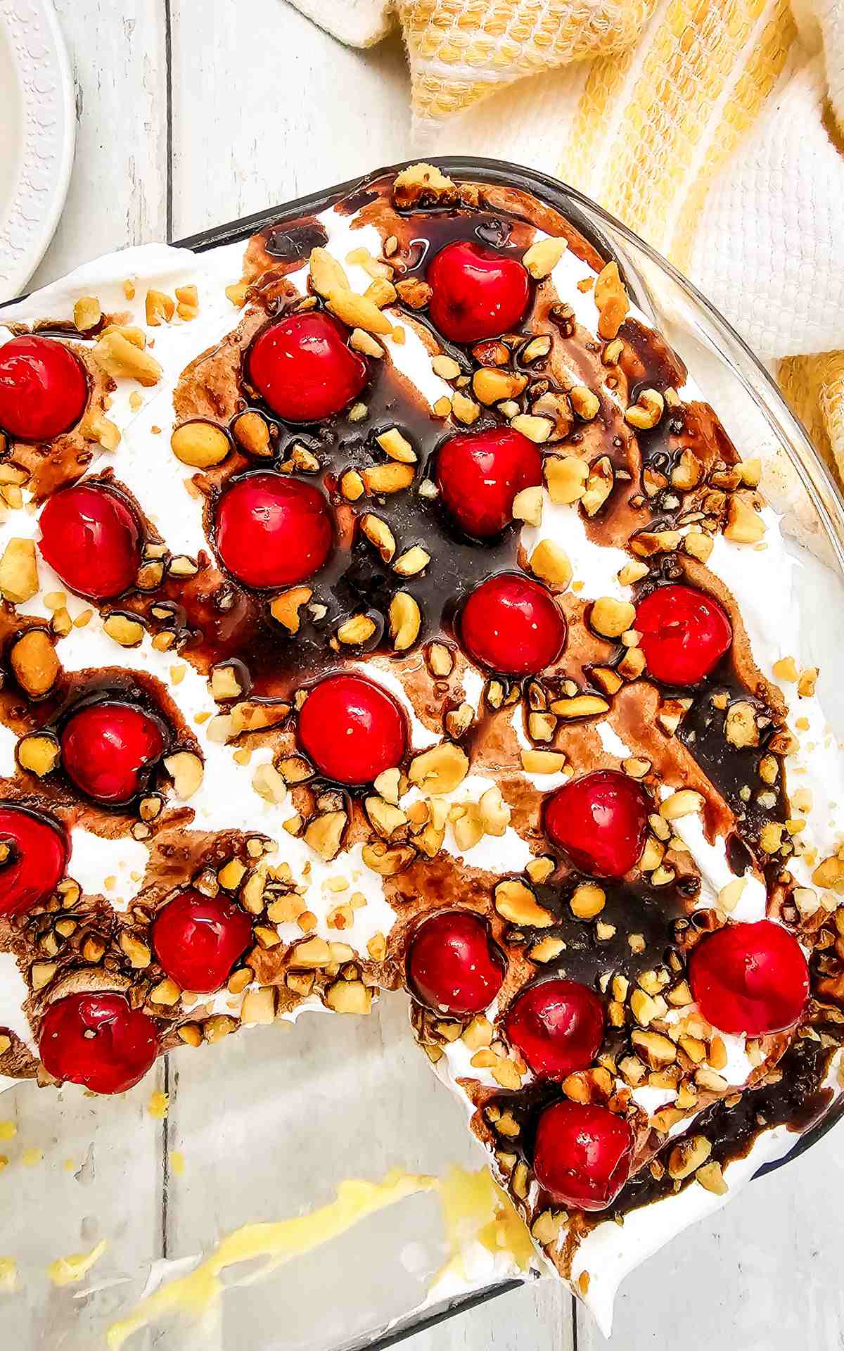 Banana Split Cake Mix recipe topped with cherries and nuts.