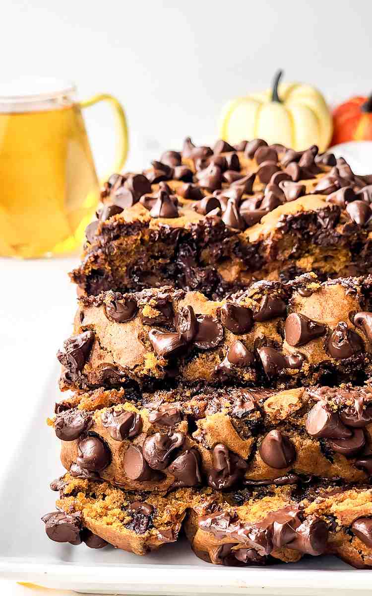 Close up of slices of chocolate chip pumpkin loaf topped with chocolate chips.