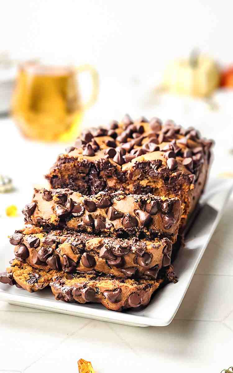 Pumpkin and Chocolate Chip Bread sliced on a serving dish.