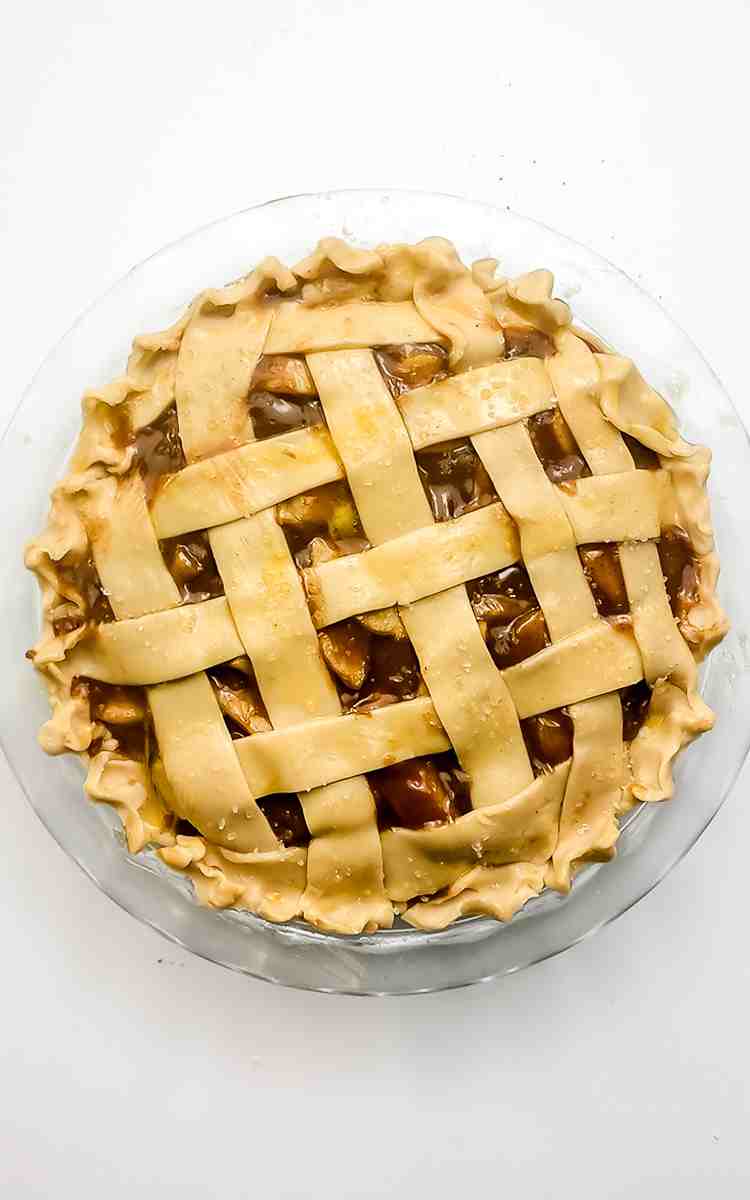 Unbaked lattice top apple pie.